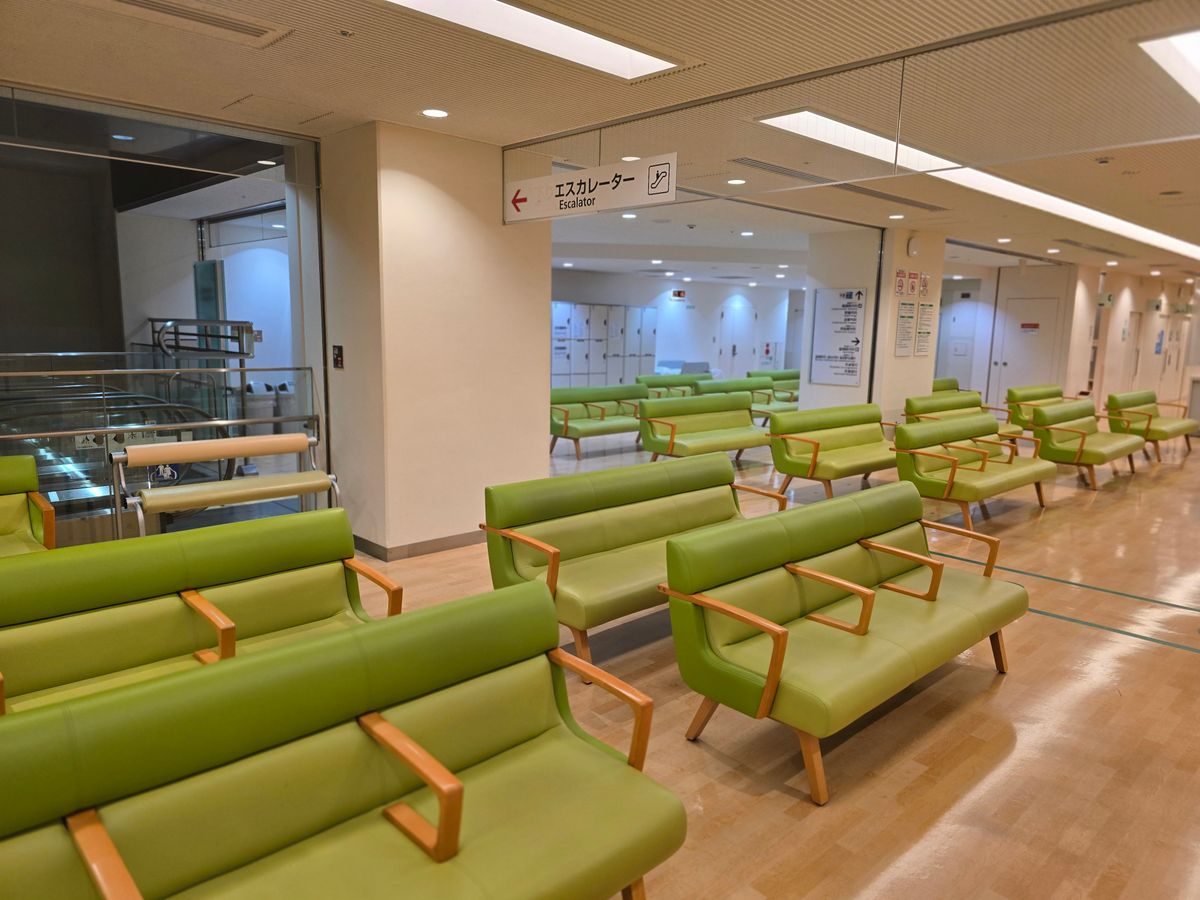 A man sitting in a doctors waiting room