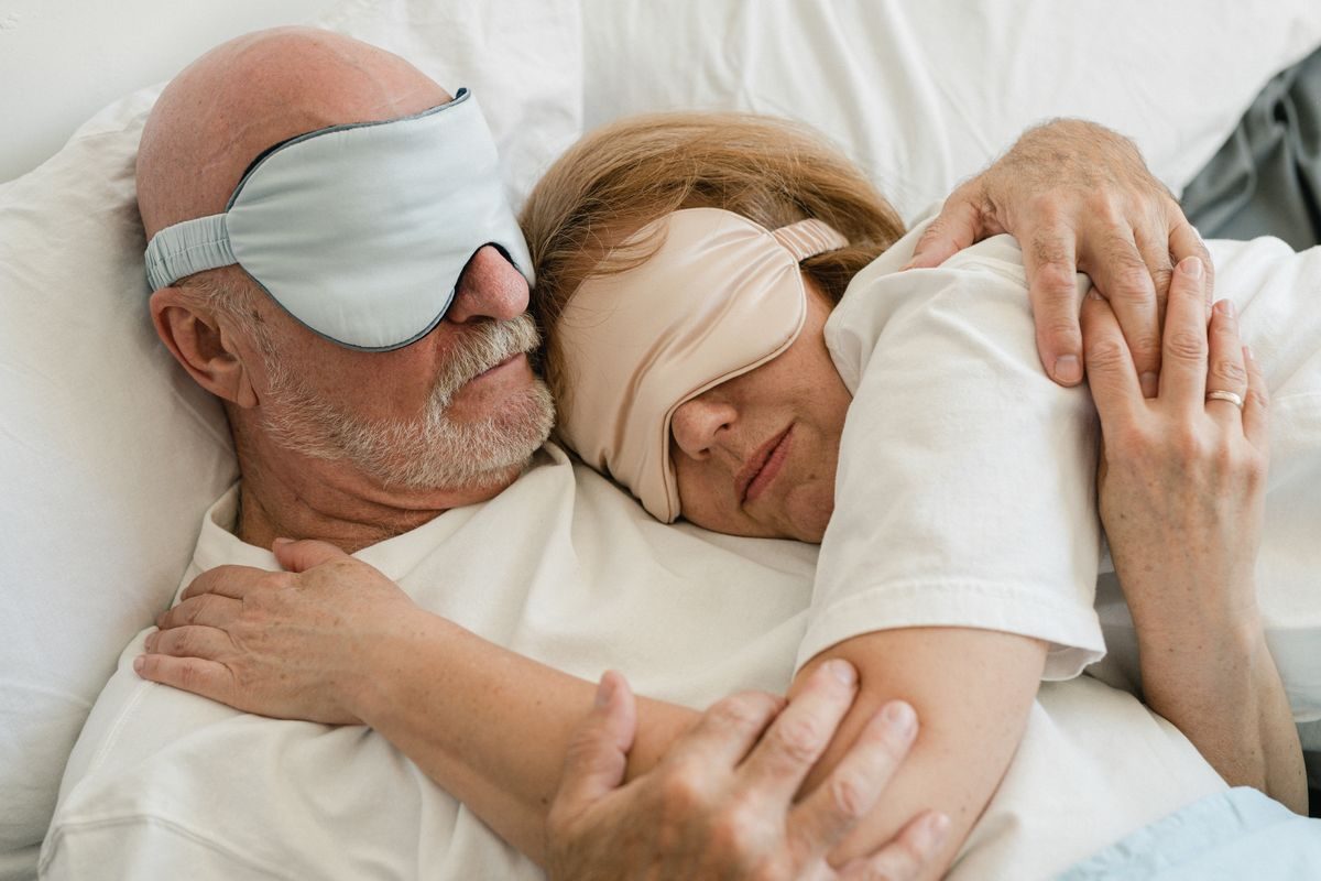 A person sleeping peacefully in bed